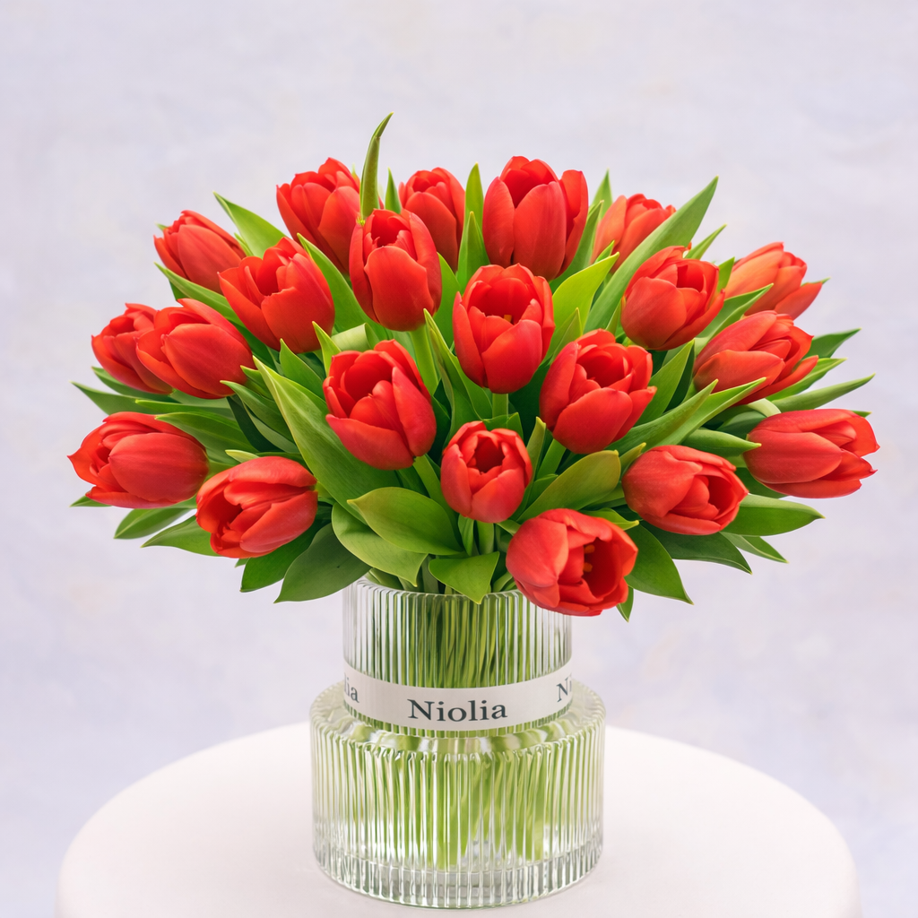 Luxury red tulip flower arrangement in a modern glass vase by Niolia, San Francisco florist