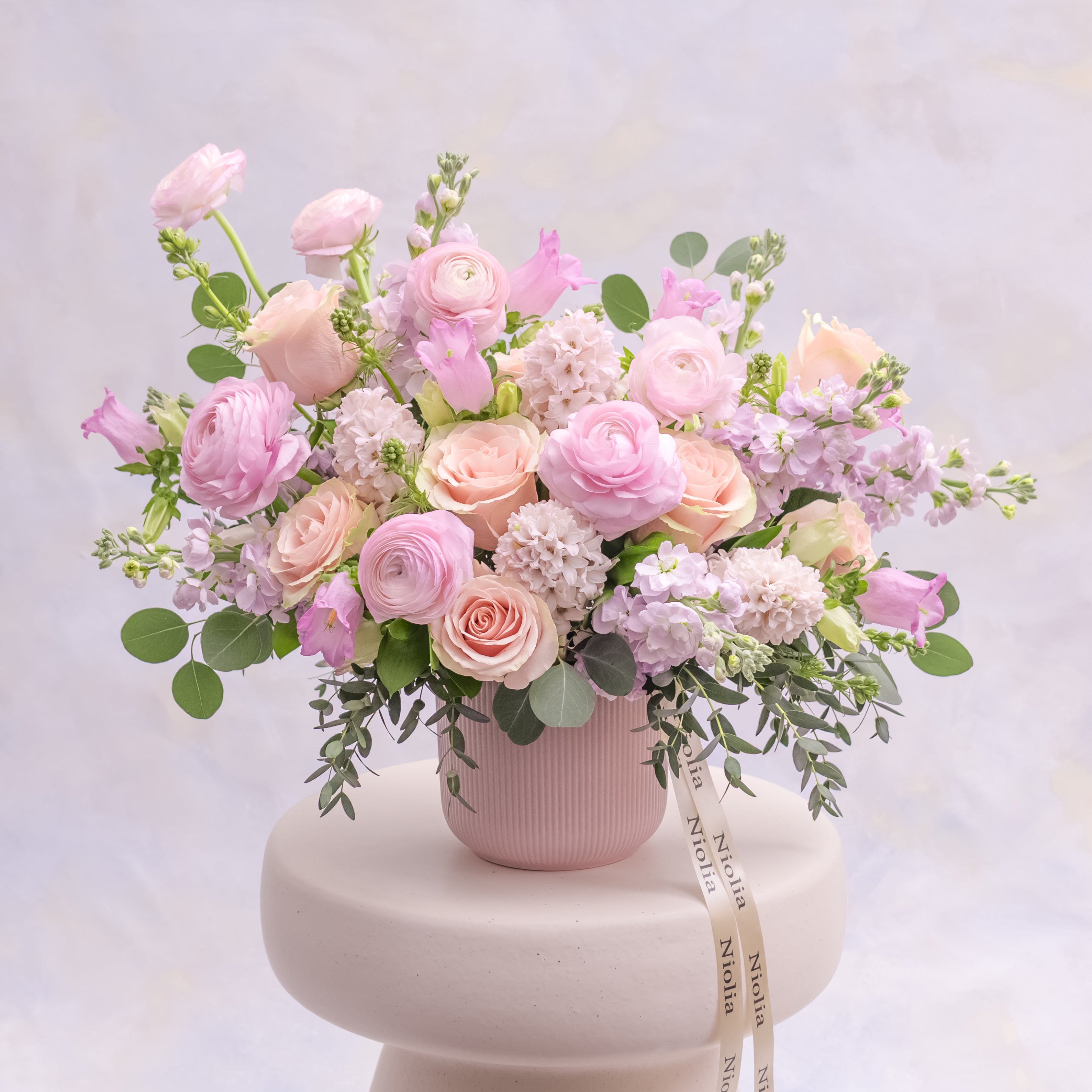 Pink Edit collection featuring pink tulip bouquets wrapped in black paper by Niolia, San Francisco florist