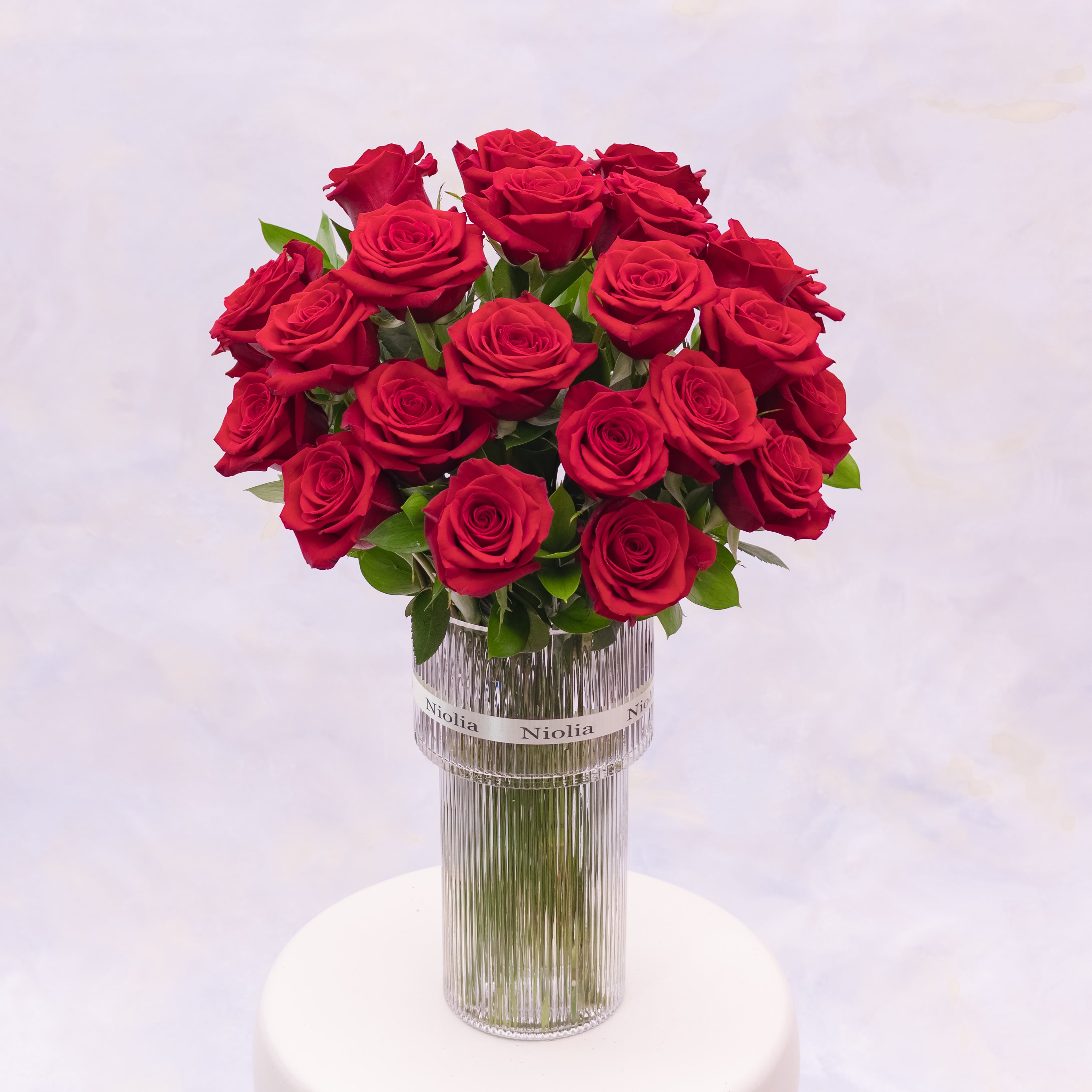 This timeless arrangement features two dozen premium red roses. Styled in Niolia’s refined classic aesthetic. Available for same-day flower delivery in San Francisco and surrounding Bay Area cities.