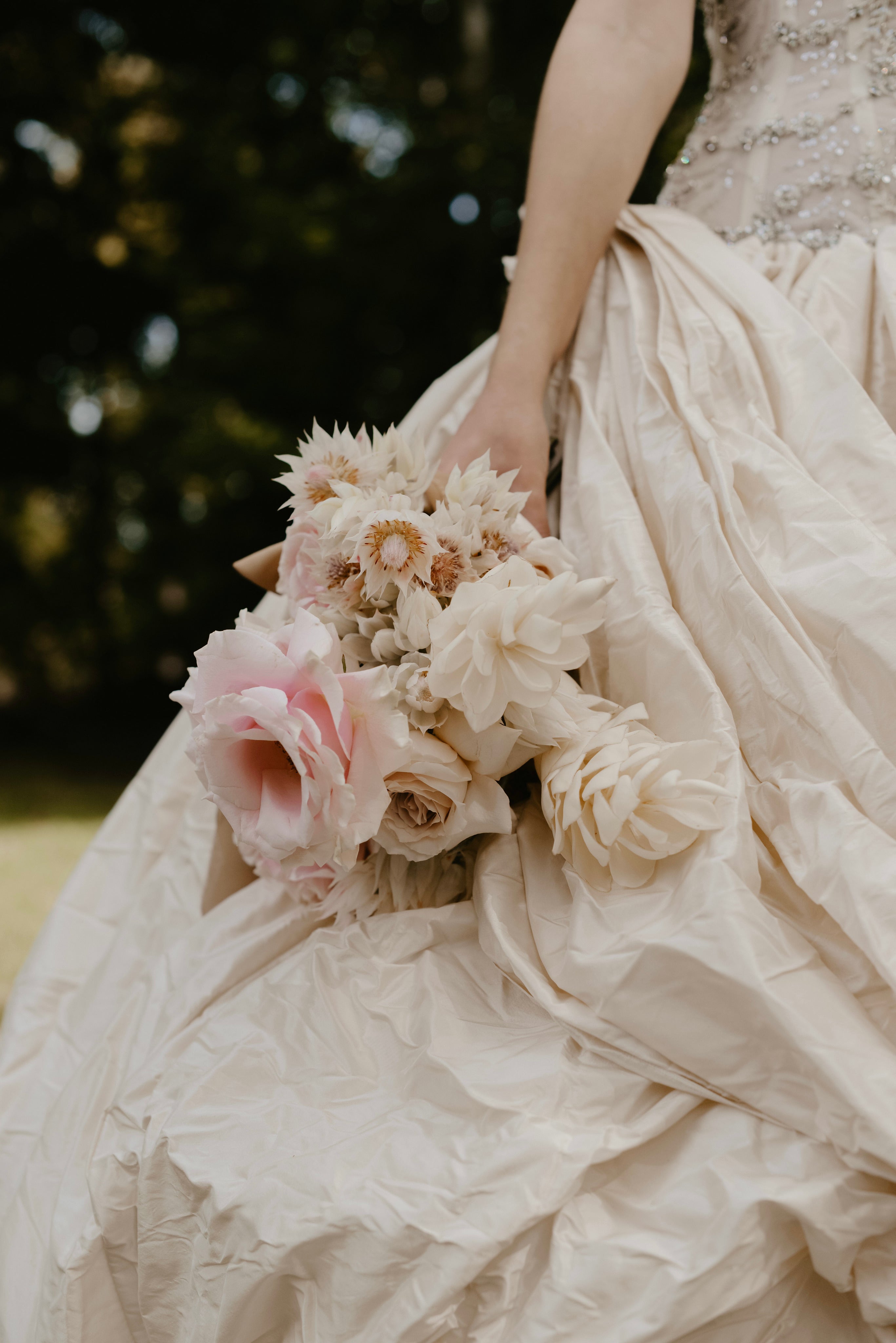Flowing gowns and pink bridal bouquet
